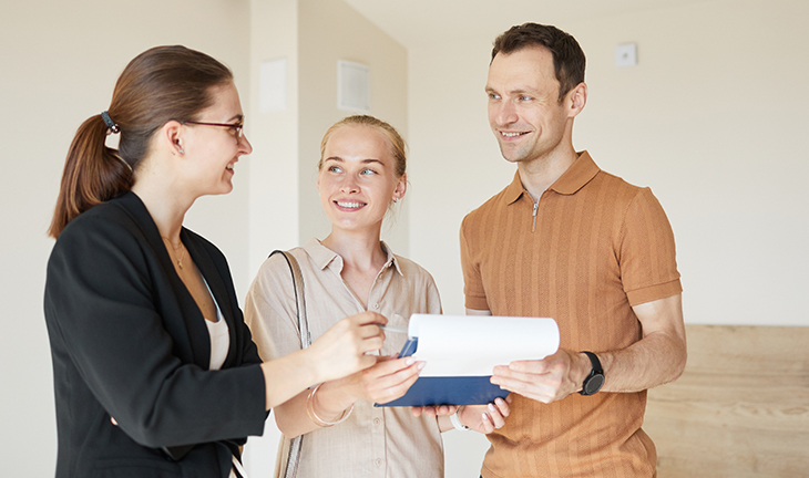 Leasing agent showing an apartment to prospective renters during an apartment tour